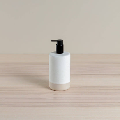 Ceramic soap dispenser in oatmeal glaze with black pump