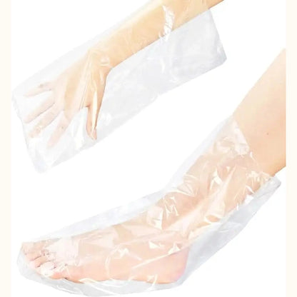 Transparent single-use plastic mitten and bootie liners fitting hands and feet