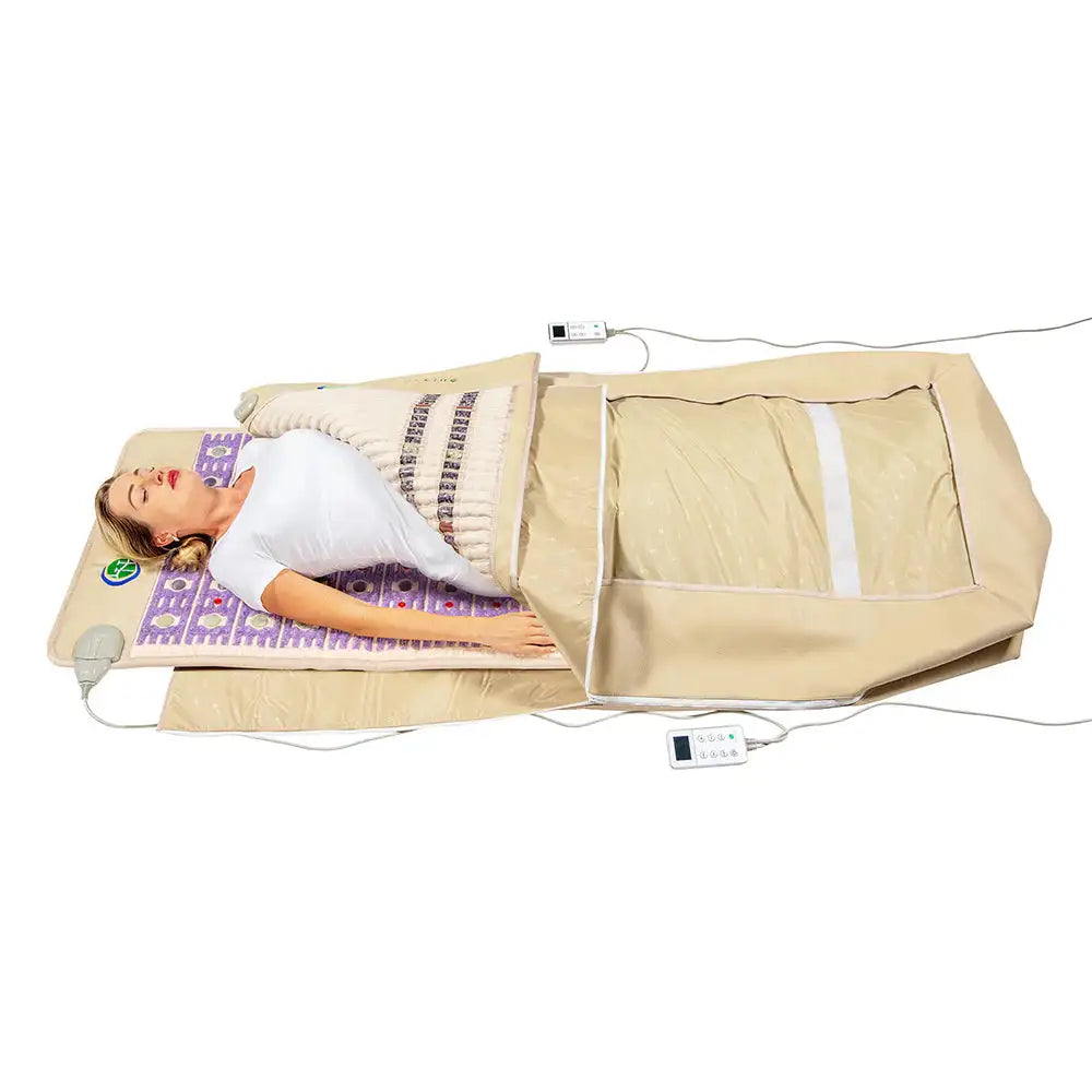 Woman using HealthyLine Taj 360 Wrap Set for full body infrared heat and PEMF therapy