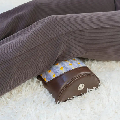 Heated amethyst bolster providing knee support for relaxation