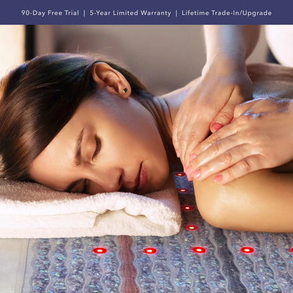 Woman receiving back massage on HealthyLine red light therapy mat with 90-day free trial banner