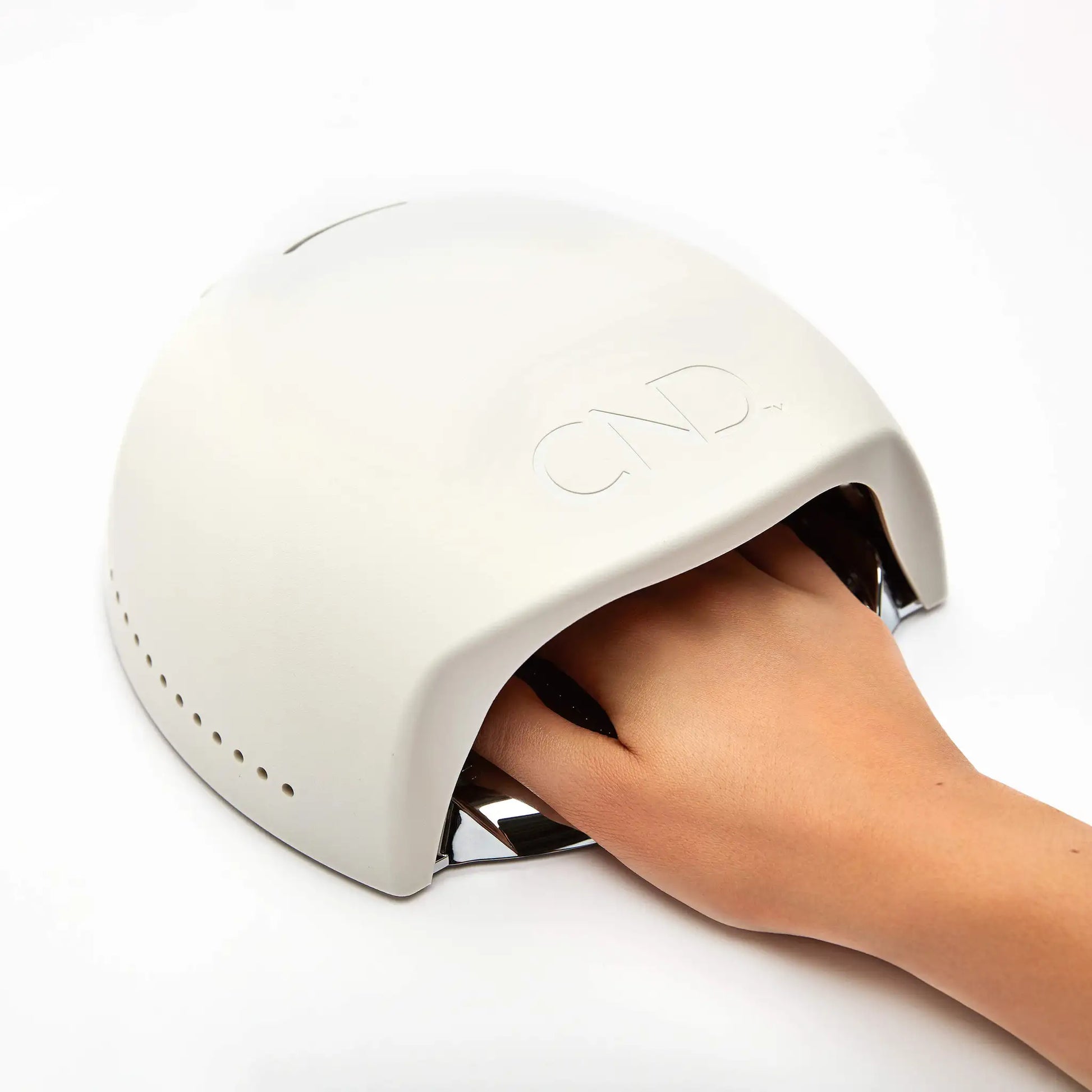 CND LED Lamp curing a manicure