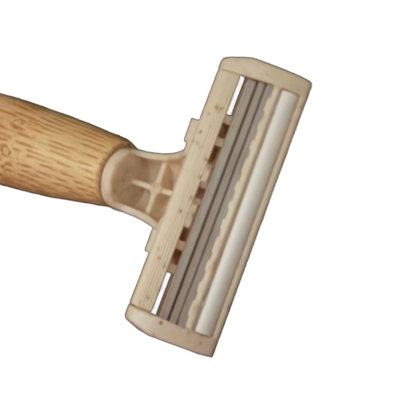 Close-up of the wheat straw triple blade pivot head on the Tess bamboo razor
