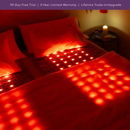 Queen bed with HealthyLine TAJ red light therapy topper in use
