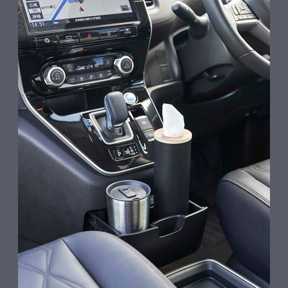 Small black Yamazaki Home Round Tissue Case in the center console cup holder of a car