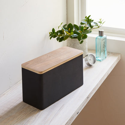 Front view of black Countertop Organizer on shelf by Yamazaki Home.