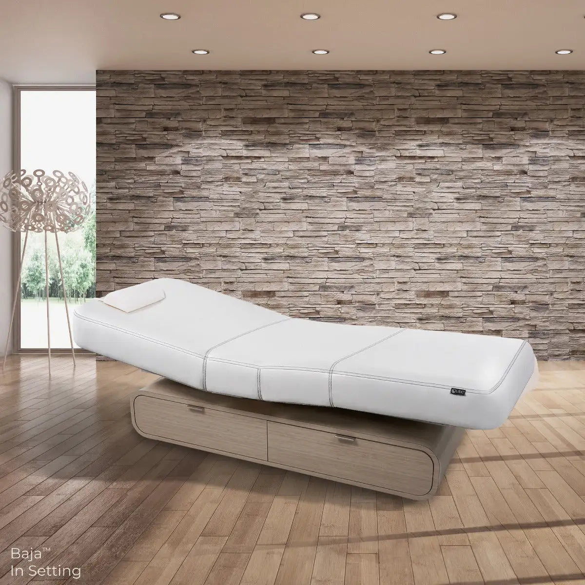 Living Earth Crafts Baja Oval multi-purpose treatment table in spa room setting