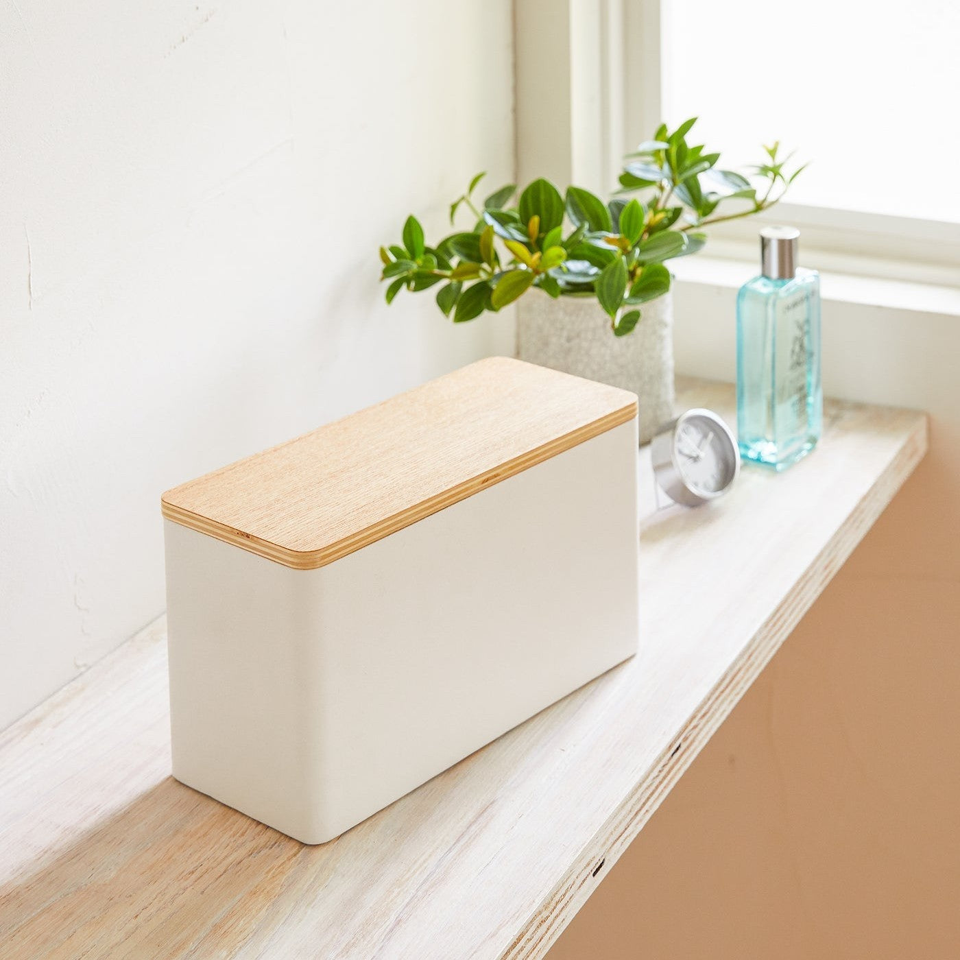 White Countertop Organizer on shelf by Yamazaki Home.