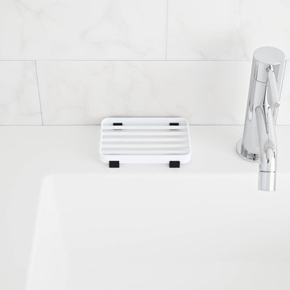 Front view of White Slotted Soap Tray on bathroom countertop by Yamazaki Home.
