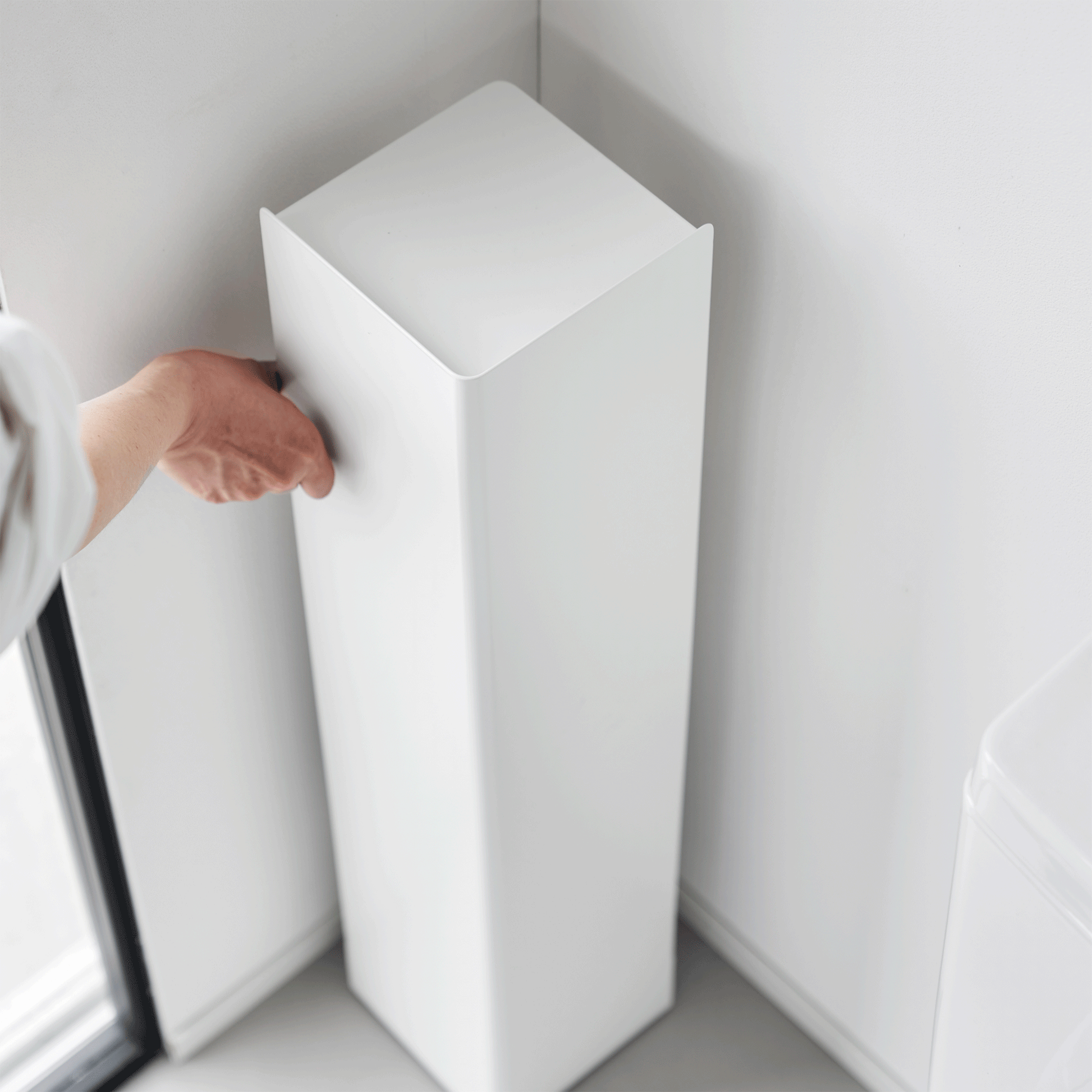 Gif of white Yamazaki Home Rolling Bathroom Organizer being spun around