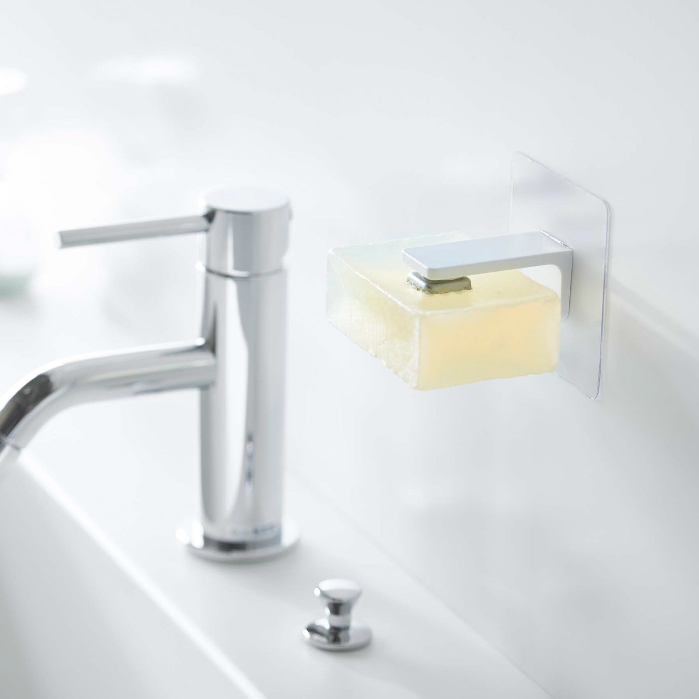 White Yamazaki Home Magnetic Soap Holder installed next to sink
