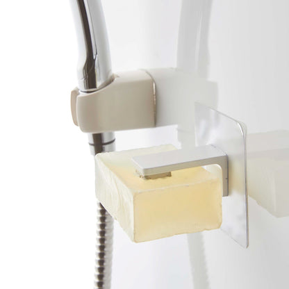 White Yamazaki Home Magnetic Soap Holder installed next to shower head