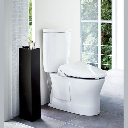 Yamazaki Home black Toilet Organizer holding decor pieces in bathroom.