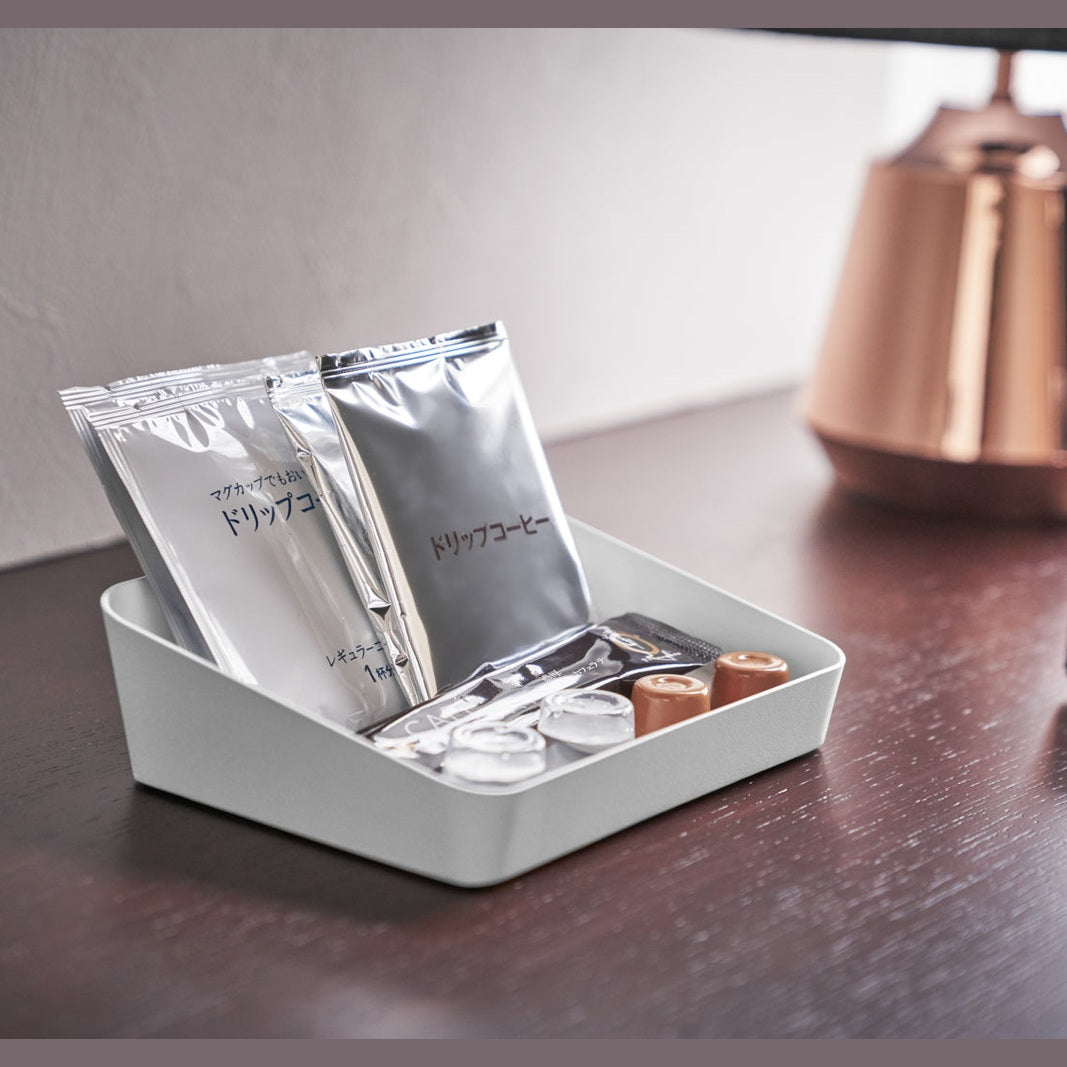 Medium white Accessory Tray holding coffee products on desk by Yamazaki Home.