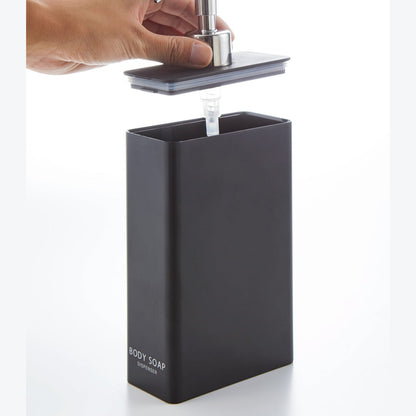Black Body Soap Dispenser with top off on white background by Yamazaki Home.