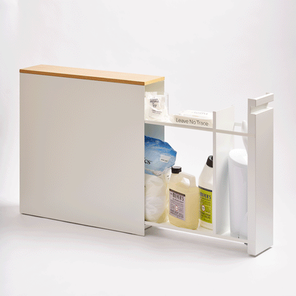 Gif of Pull-Out Bathroom Storage Cabinet - Steel + Wood in White by Yamazaki Home showing the pull-out cabinet being pulled out and closed with a white background.