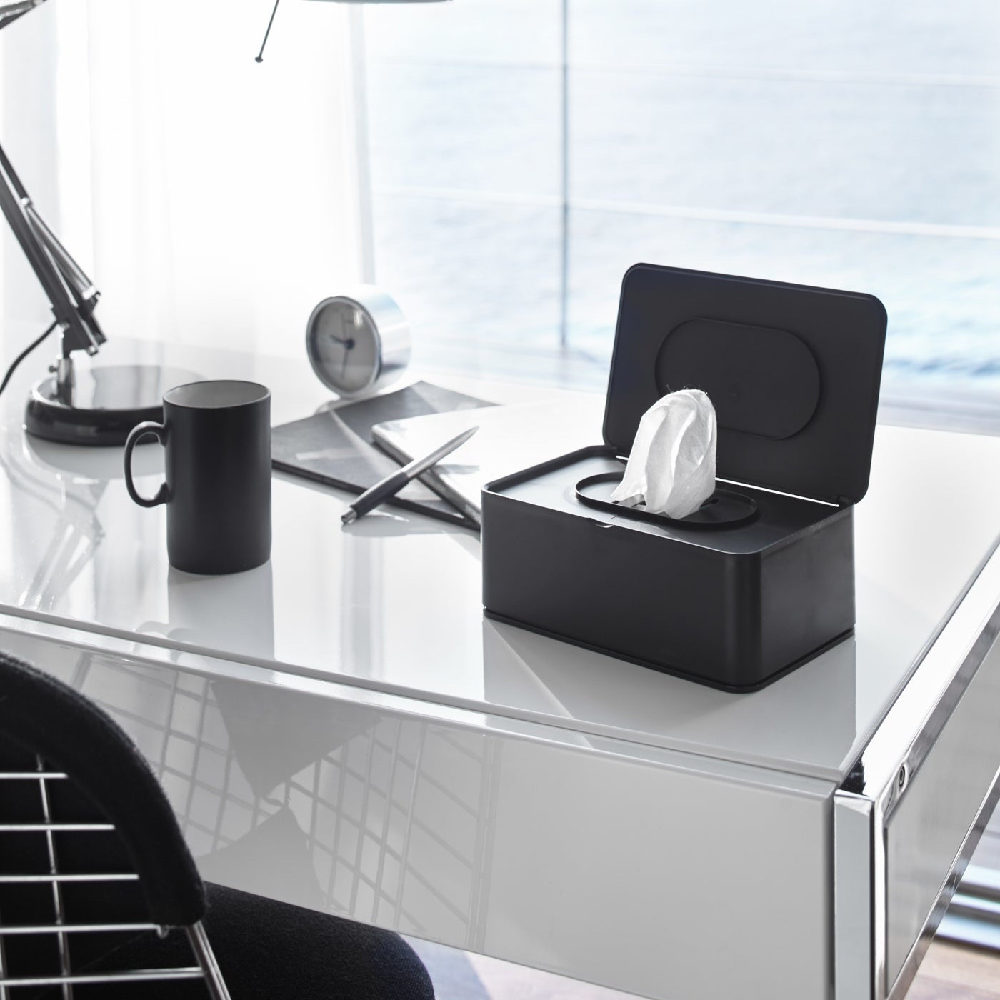 Open black Wet Tissue Case on office desk by Yamazaki Home.
