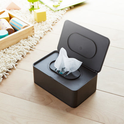 Aerial view of open black Wet Tissue Case containing wet wipes by Yamazaki Home.