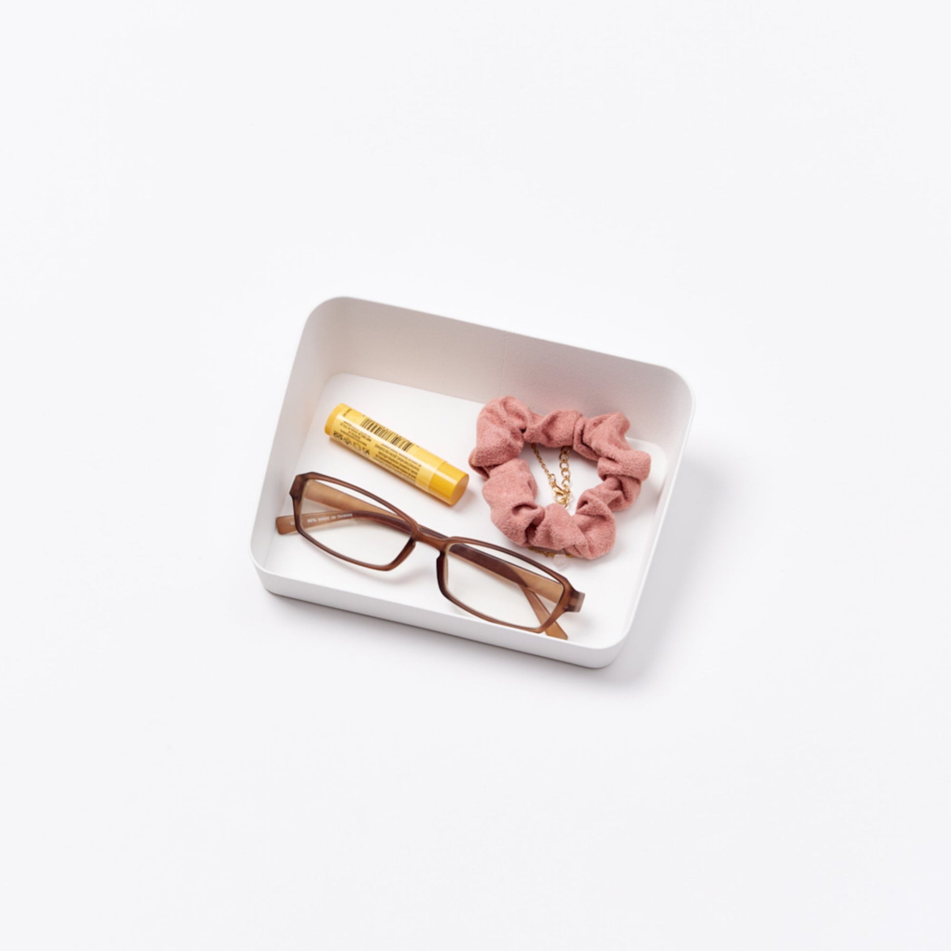 Yamazaki Home Vanity Tray - Angled - Two Sizes with props, set against a white background.