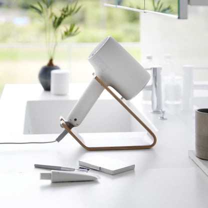 Side view of ash Yamazaki Home Hair Dryer and Iron Stand storing a hair dryer