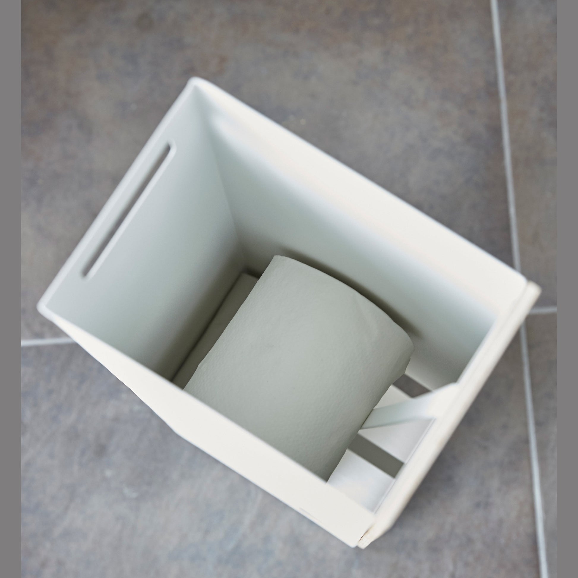 Aerial view of white Toilet Paper Stocker without cover holding toilet paper rolls by Yamazaki home.