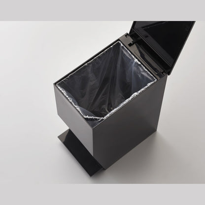 Aerial view of black Trash Can containing plastic bag on white background by Yamazaki Home.