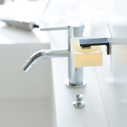 Black Yamazaki Home Magnetic Soap Holder installed next to sink