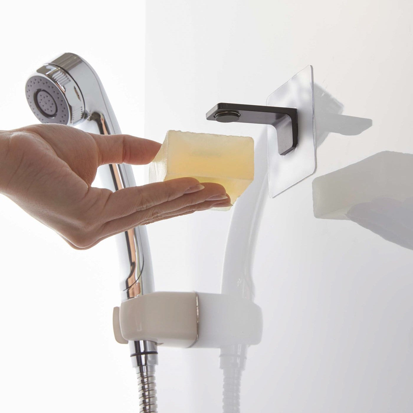 Taking out soap from black Yamazaki Home Magnetic Soap Holder