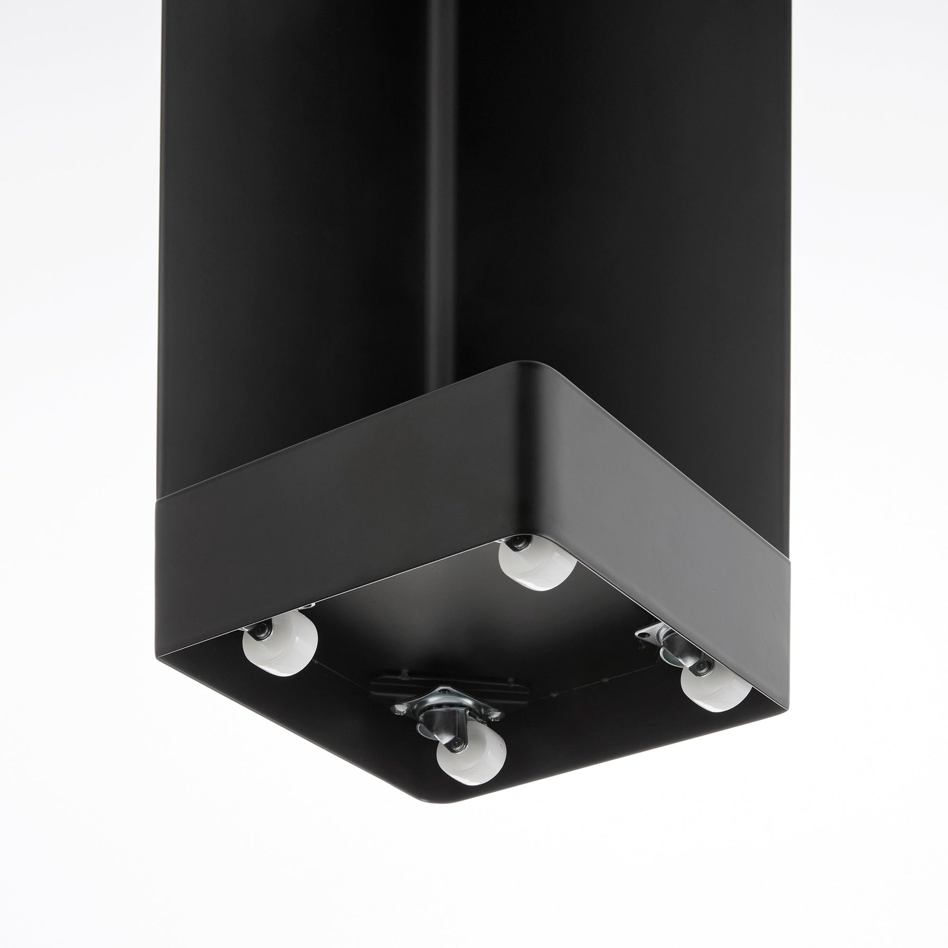 Close up view of underside of black Yamazaki Home Rolling Bathroom Organizer showing its wheels