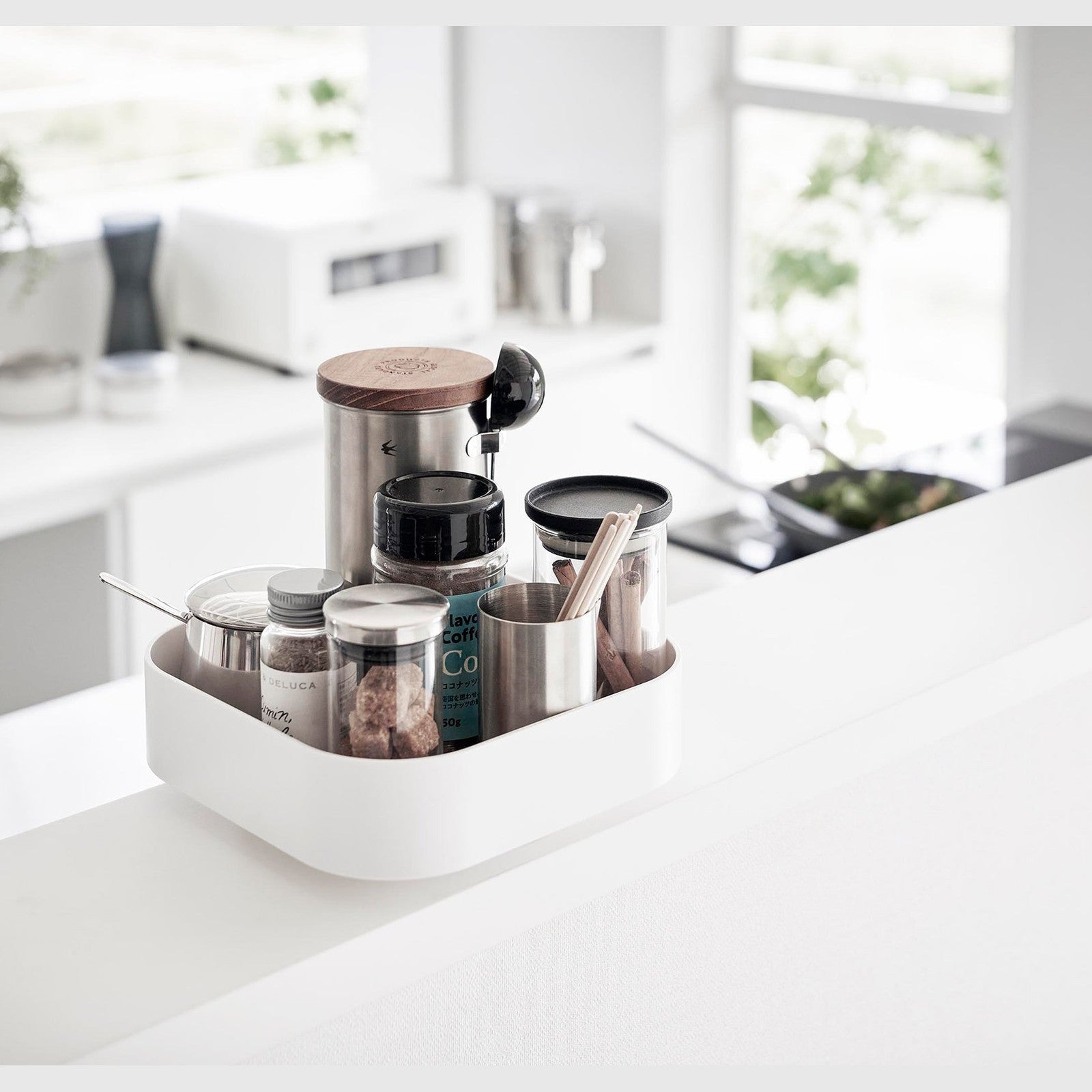 White Yamazaki Home Rotating Storage Tray with coffee accessories stored
