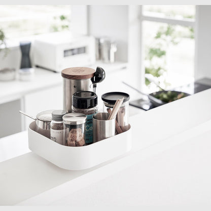 White Yamazaki Home Rotating Storage Tray with coffee accessories stored
