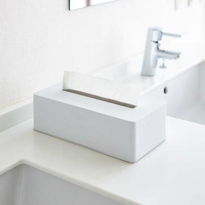 White Tissue Case on bathroom sink countertop by Yamazaki Home.