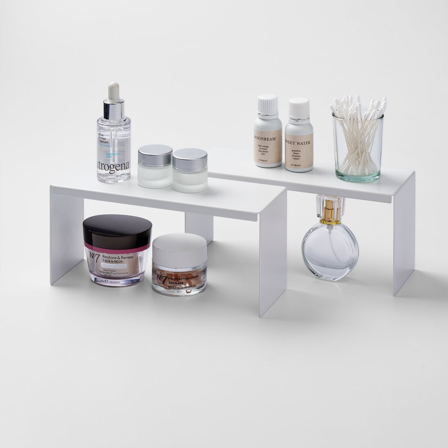 Yamazaki Home Medicine Cabinet Riser [Set of 2] with props, set against a white background.