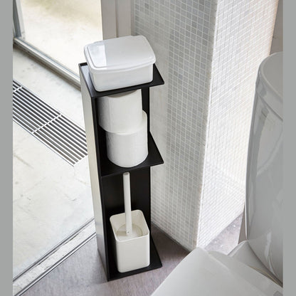 Yamazaki Home black Toilet Organizer holding toilet paper, toilet brush, and wet wipe holder in bathroom.