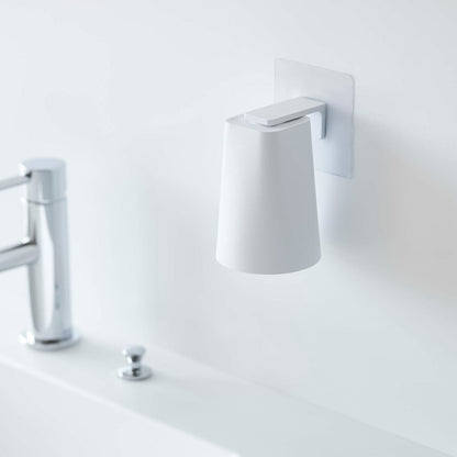 White Yamazaki Home traceless adhesive magnetic cup installed next to sink