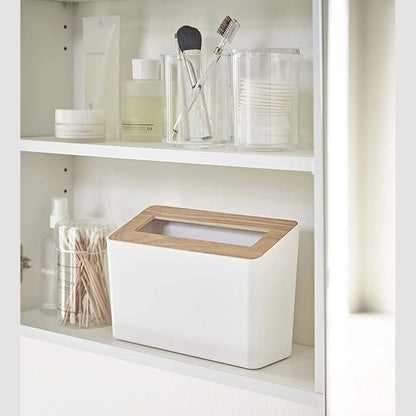 Front view of white Countertop Waste Bin on bathroom shelf by Yamazaki Home.