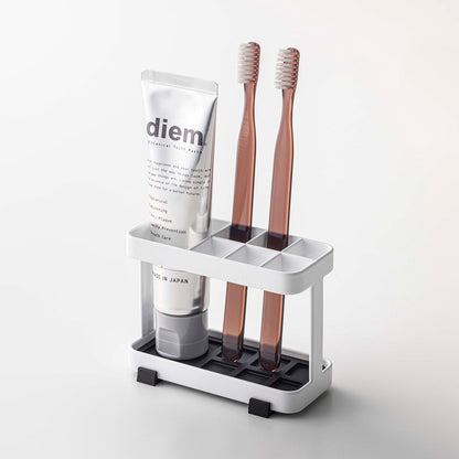 Prop photo showing Toothbrush + Toothpaste Stand with various props.