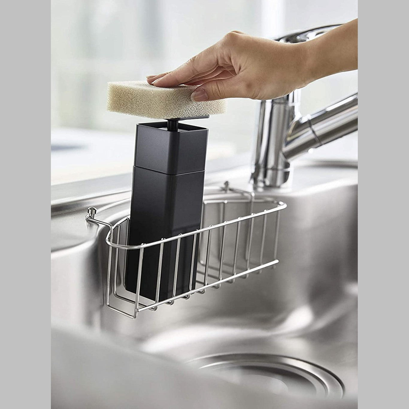 Black One-Handed Push Soap Dispenser in kitchen sink by Yamazaki Home.