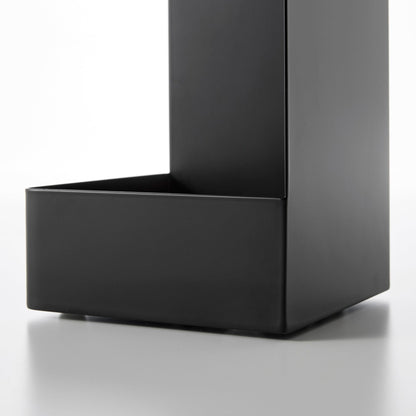 Close up view of bottom of black Yamazaki Home Rolling Bathroom Organizer