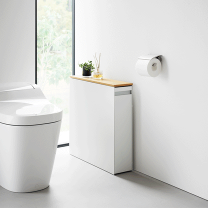 Gif of white Yamazaki Home Pull-Out Bathroom Storage Cabinet opening and closing