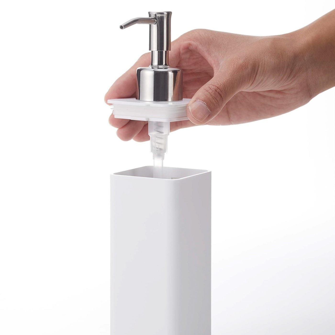 Removing lid from white Yamazaki Home square soap dispenser