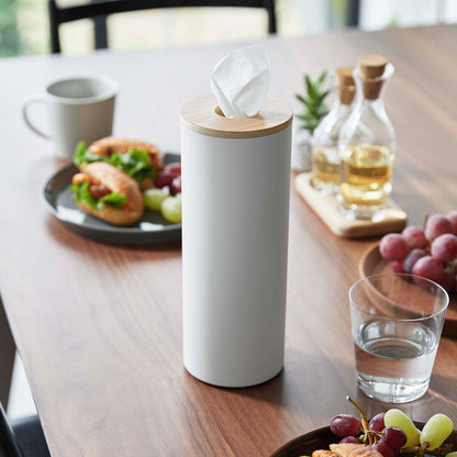 Large White Yamazaki Home Round Tissue Case on afully set dining table
