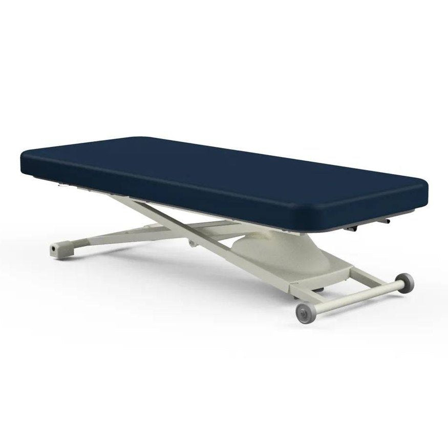 Oakworks Proluxe Flat Top electric massage table with navy blue padding and beige X-frame scissor lift