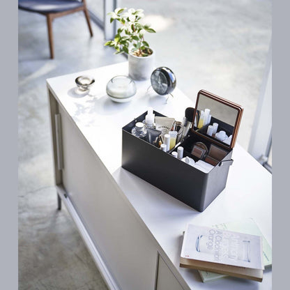 Black Makeup Organizer holding makeup products on table by Yamazaki Home.