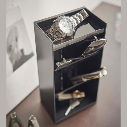 Close up of black Yamazaki Home Accessory Organizer holding accessories such as pens and sunglasses