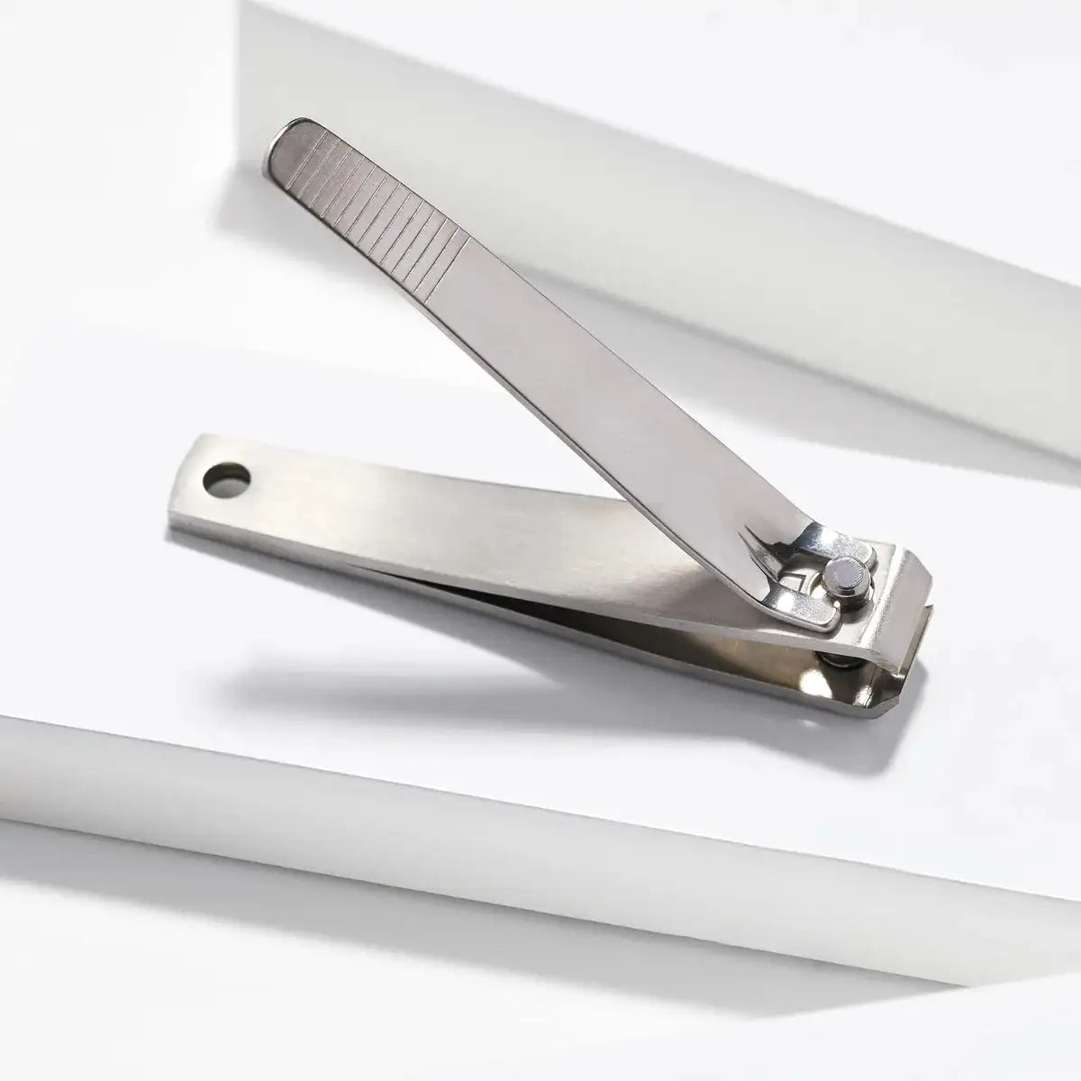 Tweezerman toenail clipper side view showing strong lever and stainless steel build