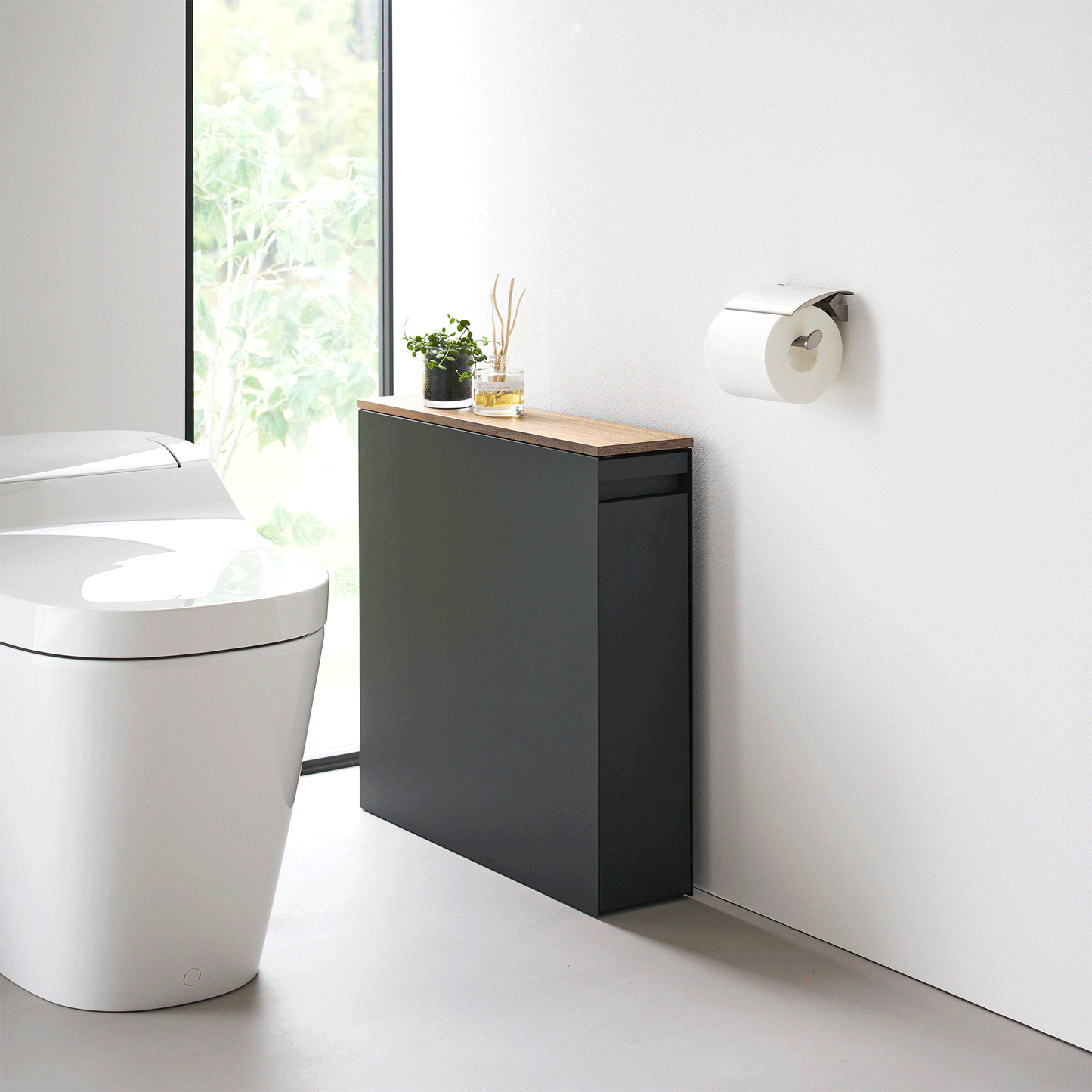 Gif of black Yamazaki Home Pull-Out Bathroom Storage Cabinet opening and closing