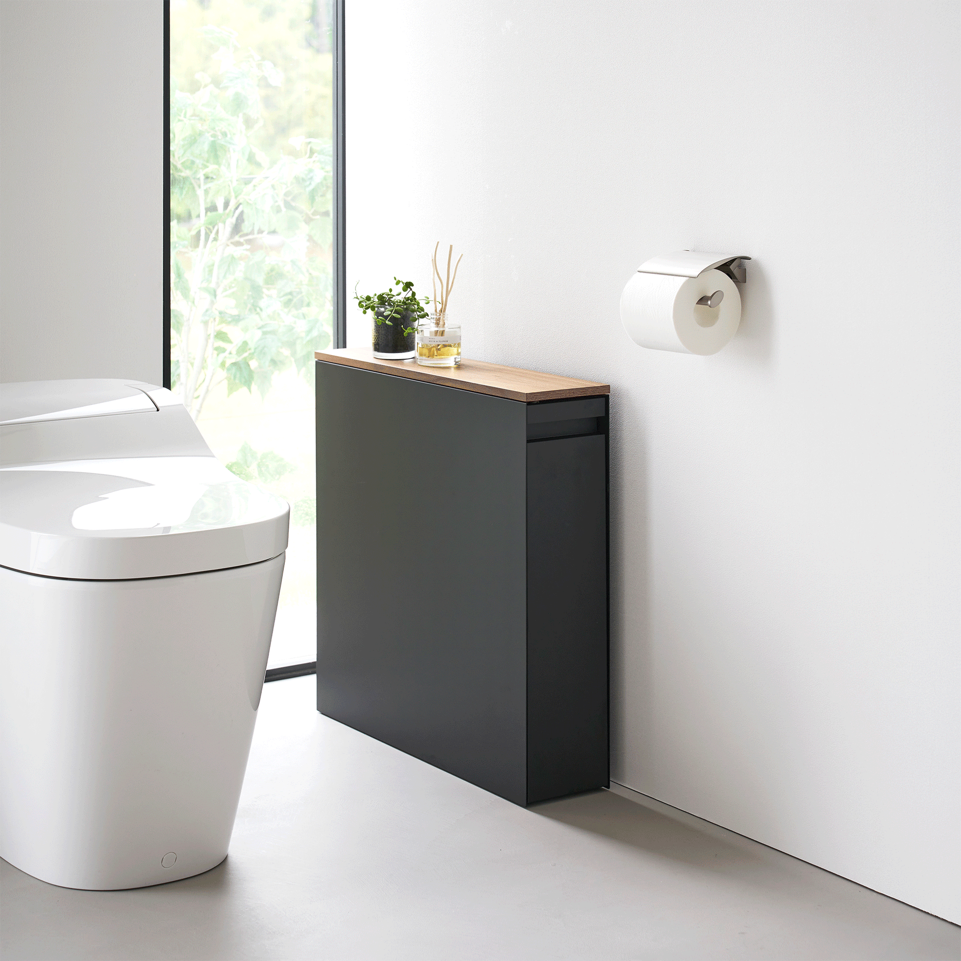 Gif of black Yamazaki Home Pull-Out Bathroom Storage Cabinet opening and closing
