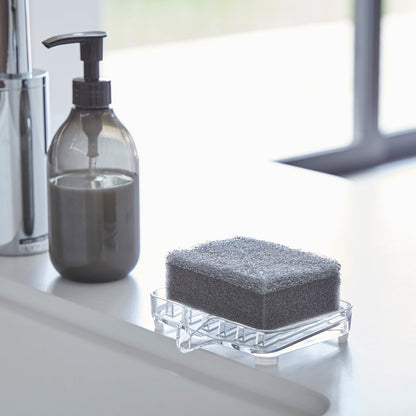 Self Draining Soap Tray on holding sponge on sink counter by Yamazaki Home.