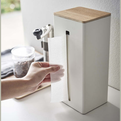 Close up of white Yamazaki Two-Sided Tissue Case with paper towels inside on a kitchen counter